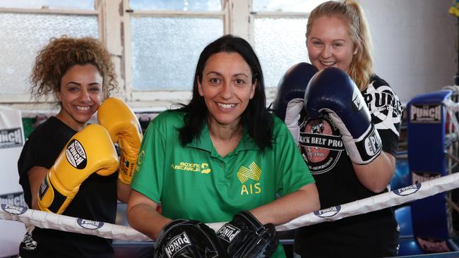 Punch Blackbelt Pro Gym owner Cindy Boniface (centre) with boxers Rachel Taliana and Laura Majewski. Mrs Boniface has just become the first woman in NSW to achieve the AIBA 1 Star Coaching certificate. Picture: AAP Image/Craig Wilson.