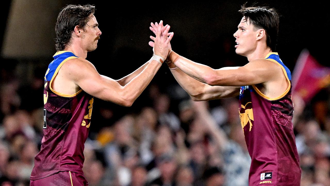 BRISBANE, AUSTRALIA - APRIL 06: Joe Daniher of the Lions celebrates with team mate Eric Hipwood oafter kicking a goal during the round four AFL match between Brisbane Lions and Collingwood Magpies at The Gabba, on April 06, 2023, in Brisbane, Australia. (Photo by Bradley Kanaris/Getty Images)