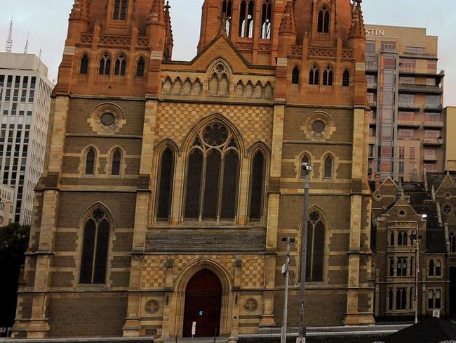 (FILES) A file photo taken on April 2, 2010 shows part of Federation Square (R) and St Paul's Cathedral (L) in Melbourne. A "significant" Islamic State-inspired Christmas Day terror plot targeting central Melbourne has been foiled after a series of arrests in raids across the city, police said on December 23, 2016.  Victoria Police chief commissioner Graham Ashton alleged those detained planned to use explosives, knives and guns to attack busy locations including Melbourne's Flinders Street train station, Federation Square and St Paul's Cathedral. / AFP PHOTO / WILLIAM WEST