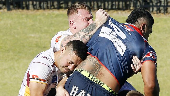 Camden’s Danny Fualalo is picked up in a tackle. Picture: John Appleyard