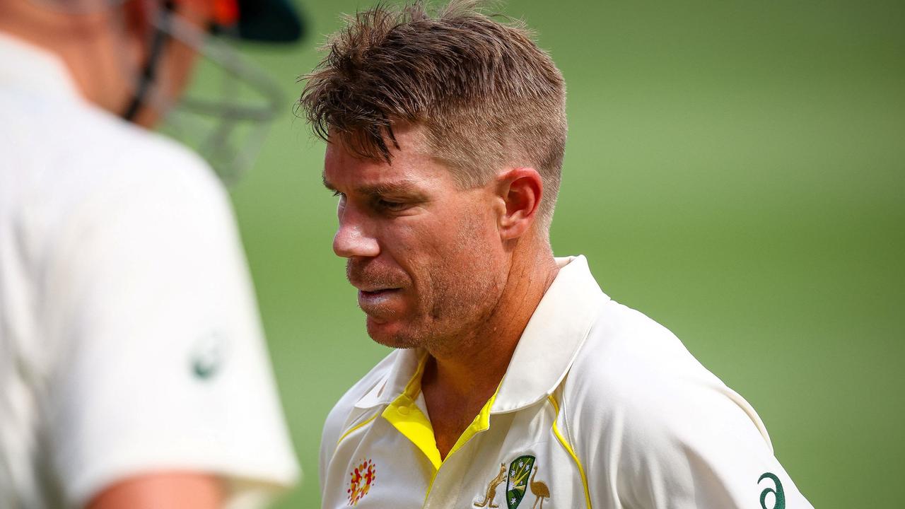 Australia's David Warner departs for 94 after being caught by England's Ben Stokes during day two of the first Ashes cricket Test match between England and Australia at the Gabba in Brisbane on December 9, 2021. (Photo by Patrick HAMILTON / AFP) / -- IMAGE RESTRICTED TO EDITORIAL USE - STRICTLY NO COMMERCIAL USE --