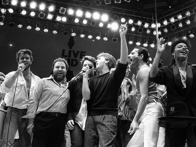 From left, George Michael of Wham!, concert promoter Harvey Goldsmith, Bono of U2, Paul McCartney, concert organiser Bob Geldof and Freddie Mercury of Queen join in the finale of the Live Aid famine relief concert, at Wembley Stadium, London, July 13, 1985. Pic: AP/Joe Schaber.