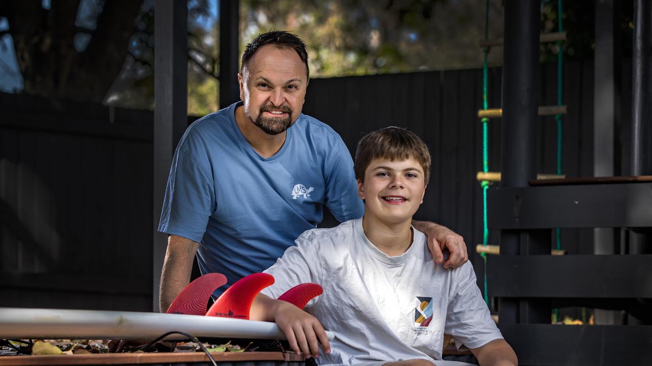 Steven Bradbury also pictured with his 13-year-old son Flyn who was involved with the rescue. Picture: Nigel Hallett
