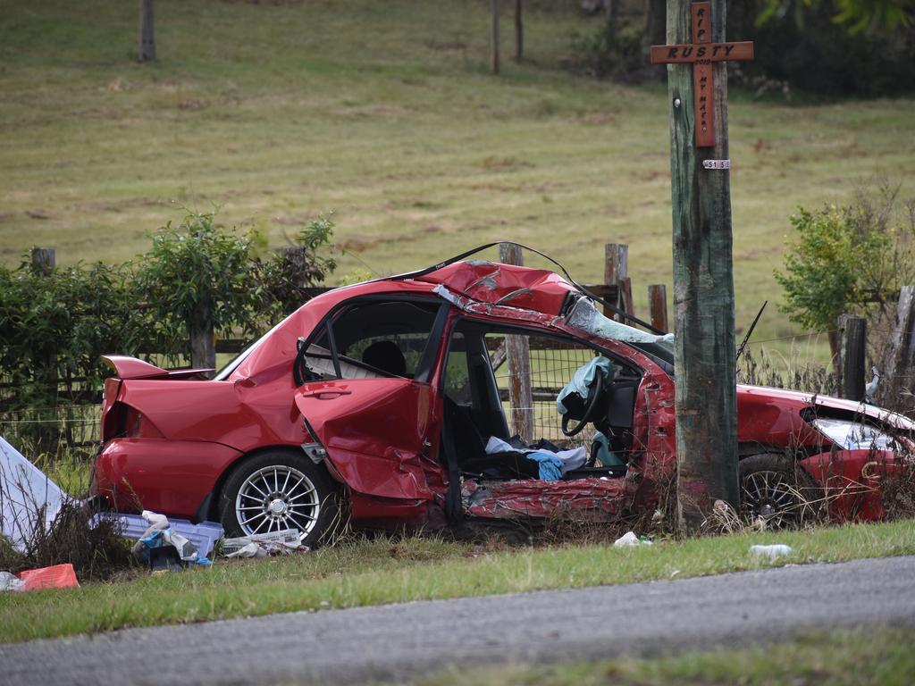 The scene of a single vehicle crash in which a red sedan Mitsubishi Lancer sedan crashed into a power pole on Rogans Bridge Rd north of Waterview Heights on Thursday, 18th February, 2021. Photo Bill North / The Daily Examiner