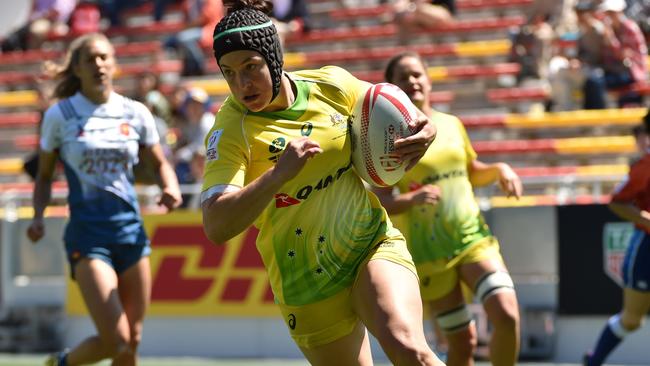 Australia's Emilee Cherry runs with the ball against France in the Japan tournament.