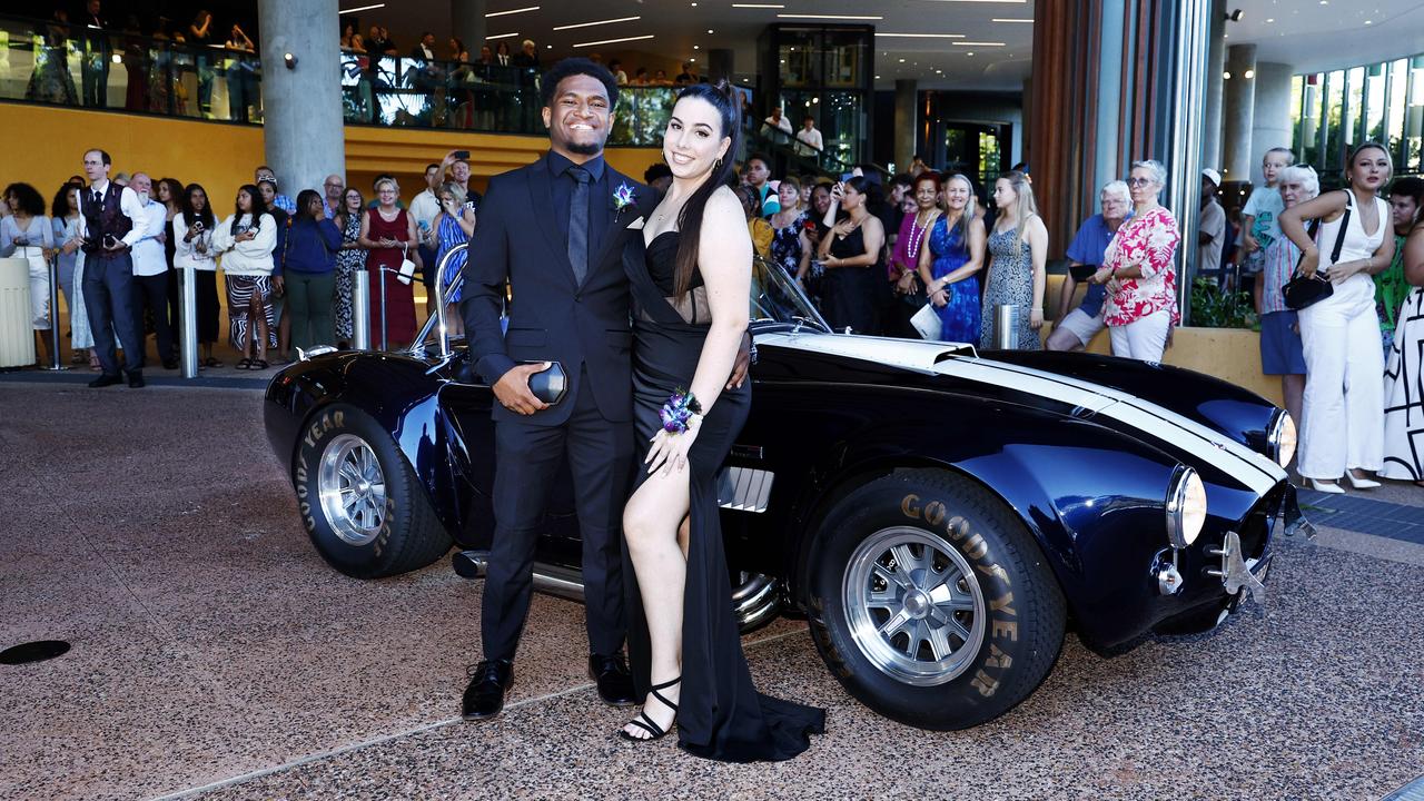 Malcolm Saga and Ashlyn Hickenbotham arrive at the Peace Lutheran College formal evening at the Cairns Convention Centre. Picture: Brendan Radke