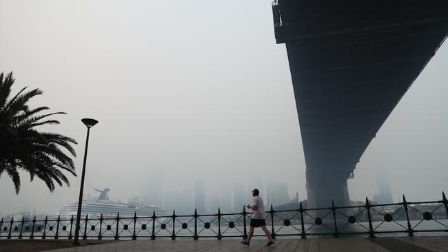 Thick smoke again descends over Sydney Harbour as the new cruise ship the Carnival Splendor arrives in Sydney. Picture: John Grainger