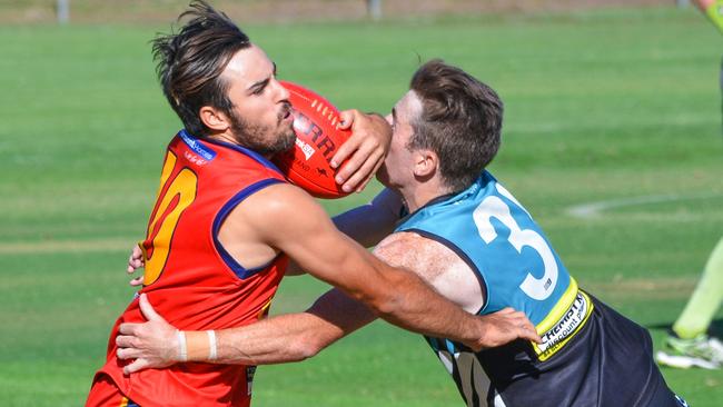 Portland's Max Buckley tackles Nathan Lornie from Flinders Park. Picture: AAP/Brenton Edwards