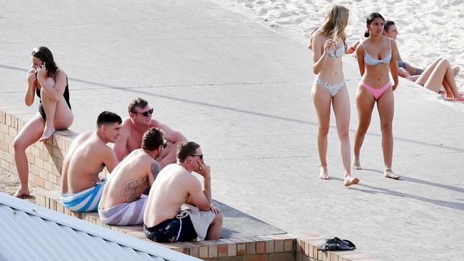 Roosters players Victor Radley, Jake Friend, Drew Hutchison and Mitchell Aubusson made the most of the sunny weather at Bronte Beach. Picture: Jonathan Ng