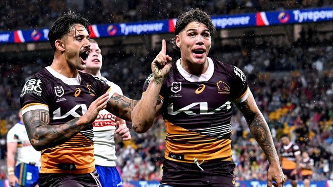 BRISBANE, AUSTRALIA - APRIL 20: Reece Walsh of the Broncos celebrates after scoring a try during the round seven NRL match between the Brisbane Broncos and Canberra Raiders at Suncorp Stadium, on April 20, 2024, in Brisbane, Australia. (Photo by Bradley Kanaris/Getty Images)