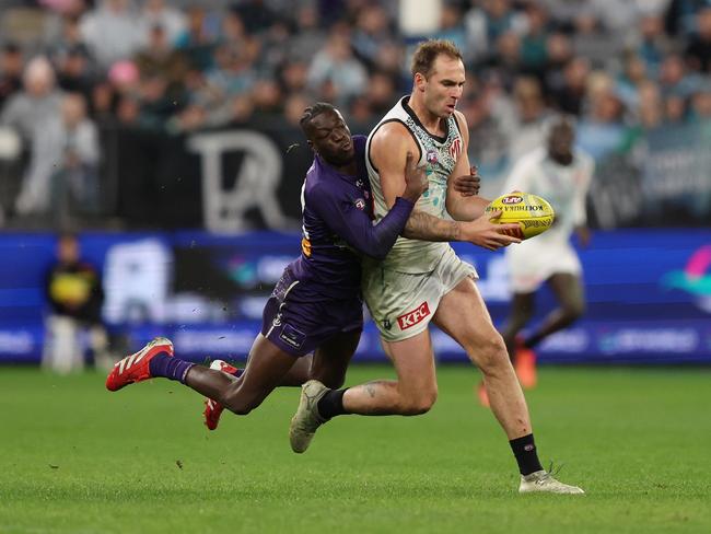 Michael Frederick chases down Jeremy Finlayson. Picture: Janelle St Pierre/AFL Photos