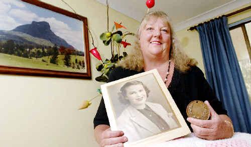 Glenda-Rae Parker of Caniaba with a 1879 Bronze Medal awarded to her great-great-great-grandmother Sarah Townsend for crocheting and a photo of her mother Joyce Lillian Coy who gave her the medal. Picture: David Nielsen