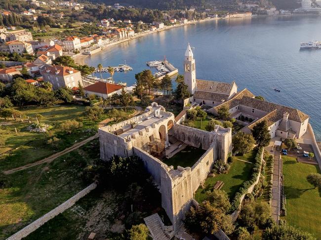 The monastery of Lopud 1483 stands sentinel over the stunning bay of Lopud Island, Croatia.