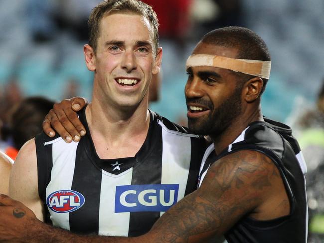 AFL Round 2 - Sydney Swans v Collingwood Magpies at ANZ Stadium in Homebush. Collingwood's Nick Maxwell (C) is congratulated by team mate Collingwood's Heritier Lumumba ( Harry O'Brien) after their win against the Swans by 20 points, also Nick's 200th game.