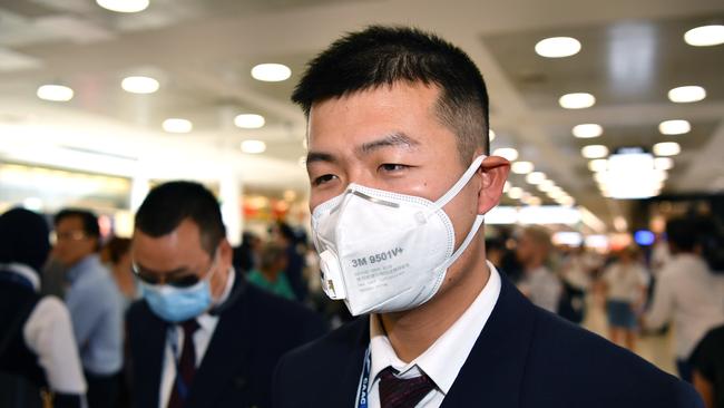 China Eastern Airlines flight crew wearing protective masks on arrival at Sydney airport on Thursday. Picture: AAP