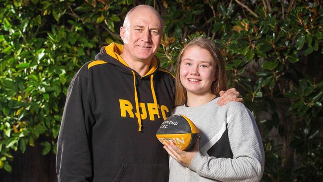 Psychologists say engaged, supportive parents — Chris Mc Neill — are the key to getting girls — like daughter Alice, 14 — through the trials and tribulations of their teenage years. Picture: Mark Stewart