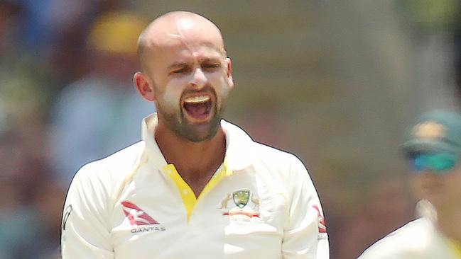 Australian bowler Nathan Lyon celebrates taking the wicket of England’s Moeen Ali during the first Ashes Test in Brisbane on Friday.