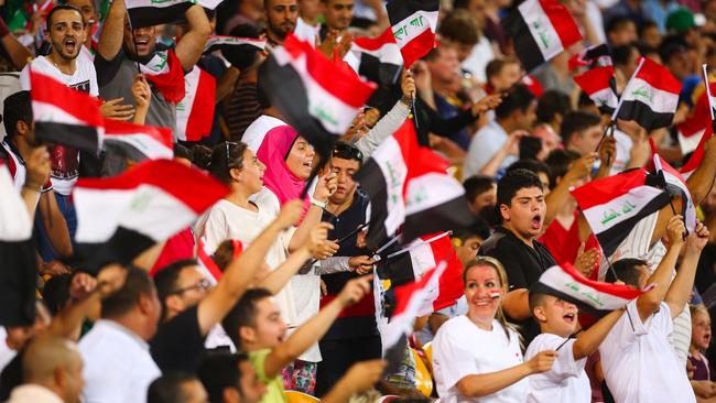 Iraq supporters cheer their team on against Japan.