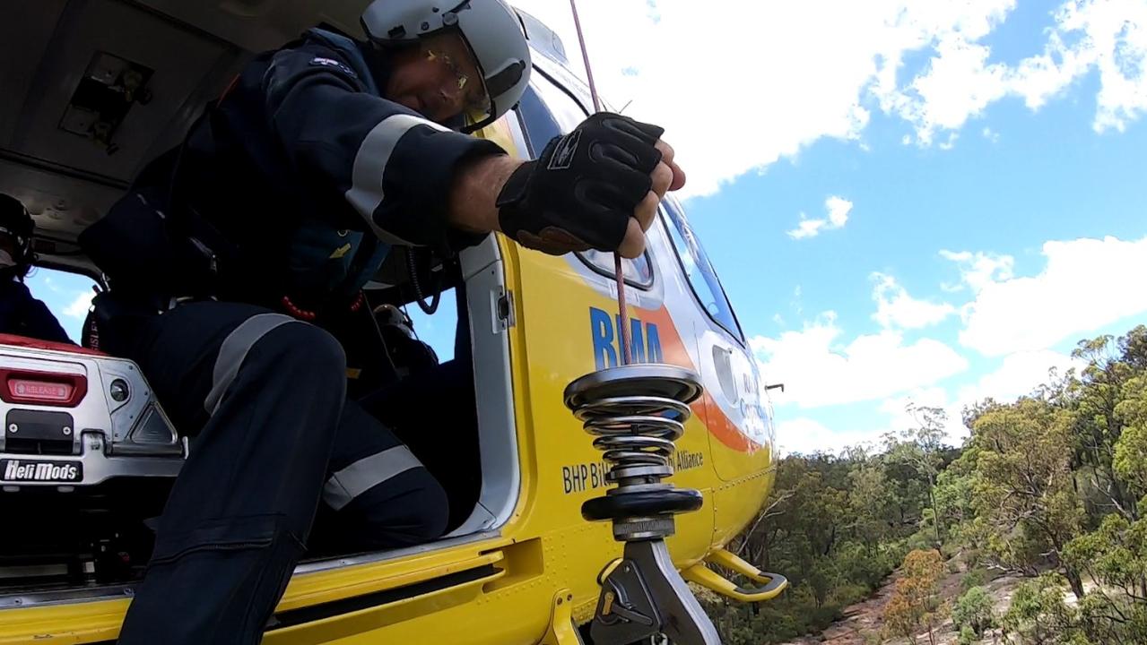 A Victorian woman in her 70s was winched from the bottom of Rainbow Falls at Blackdown Tablelands after suffering a suspected broken ankle. Photo: RACQ Capricorn Rescue