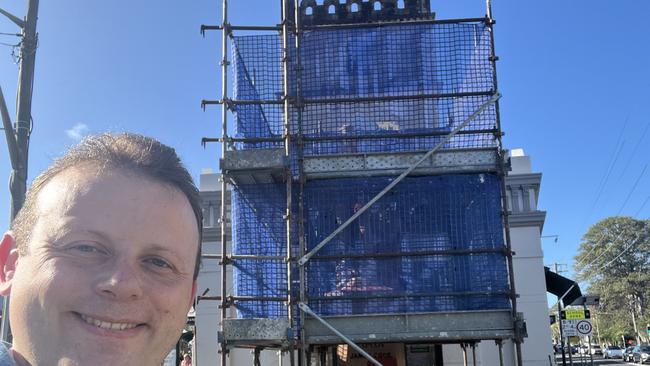 Cr Hay with the Randwick Captain Cook statue undergoing refurbishments.