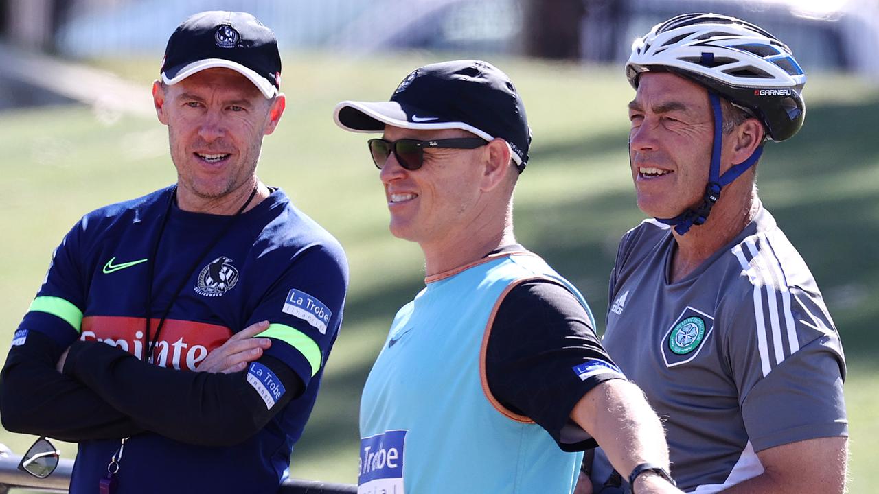 Collingwood training at Olympic Park had an interested onlooker when Alastair Clarkson dropped in mid-ride to catch up with Craig McRae and Brendon Bolton. Picture: Michael Klein