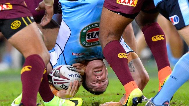 BRISBANE, AUSTRALIA - JUNE 22: Paul Gallen of the Blues is upended in the tackle Sam Thaiday of the Maroons during game two of the State Of Origin series between the Queensland Maroons and the New South Wales Blues at Suncorp Stadium on June 22, 2016 in Brisbane, Australia. (Photo by Bradley Kanaris/Getty Images)