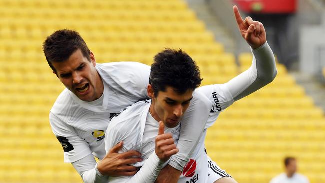 Gui Finkler of the Phoenix (R) celebrates his goal with support from Andrija Kaludjerovic.