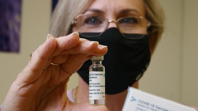 Edmonton Family Medical Centre practice manager Kerry Kresevic holds a vial of the AstraZeneca vaccine. Two out of three doses that have been supplied by Pfizer and AstraZeneca have not been given to people. Picture: Brendan Radke