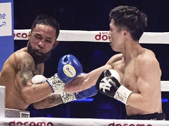 Japan's Naoya Inoue (R) throws a punch at Mexico's Luis Nery in the sixth round of their four-belt super bantamweight boxing title match at Tokyo Dome on May 6, 2024. (Photo by Kyodo News via Getty Images)