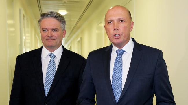 Mathias Cormann and Peter Dutton leave the party room after losing Friday's party vote. Picture: Ray Strange