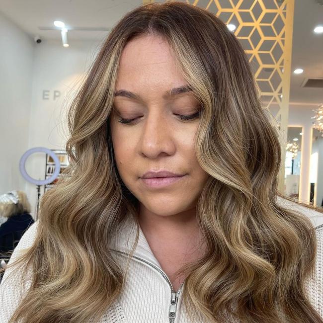 There is no more iconic pairing than beautiful balayage and waves at Epic Hair Designs salon.