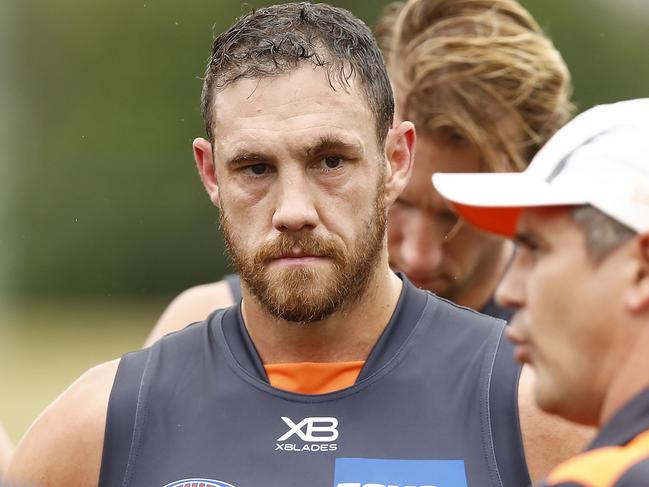 SYDNEY, AUSTRALIA - FEBRUARY 22: Shane Mumford of the Giants listens to Leon Cameron, coach of the Giants, during the AFL pre-season practice match between the Greater Western Sydney Giants and the Sydney Swans at Blacktown International Sportspark on February 22, 2019 in Sydney, Australia. (Photo by Ryan Pierse/Getty Images)