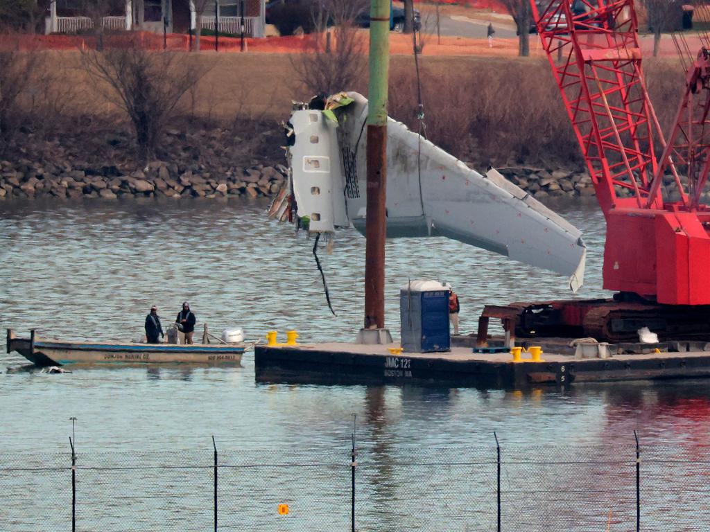 A wing of American Airlines flight 5342 is lifted from the Potomac River during recovery efforts. Picture: Getty Images via AFP