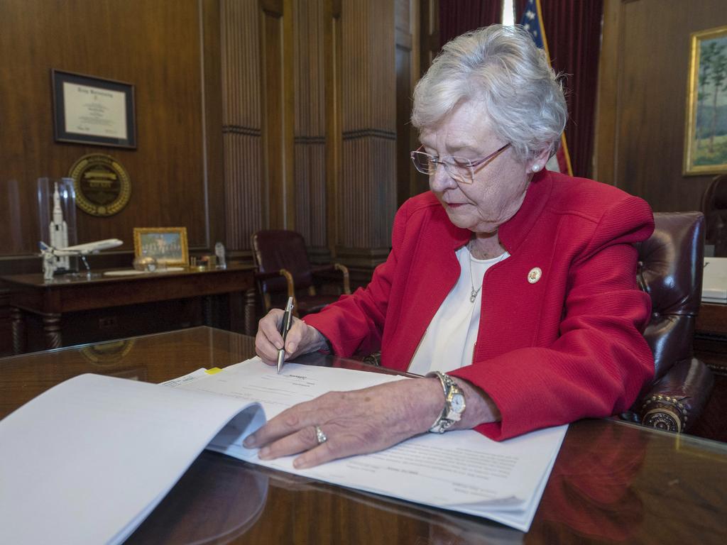 Alabama Gov. Kay Ivey signing a bill that virtually outlaws abortion in the state on Wednesday, May 15, 2019, in Montgomery, Alabama. Picture: Hal Yeager