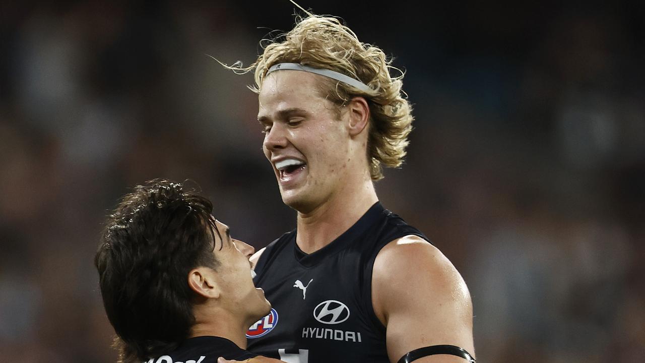 MELBOURNE, AUSTRALIA - MARCH 23: Zac Fisher of the Blues (L) celebrates with Tom De Koning of the Blues after kicking a goal during the round two AFL match between Carlton Blues and Geelong Cats at Melbourne Cricket Ground, on March 23, 2023, in Melbourne, Australia. (Photo by Daniel Pockett/Getty Images)