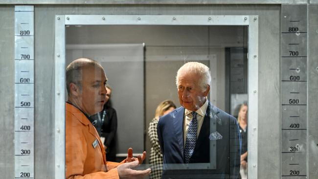 King Charles III listens to research scientist Dr. Matt Plucinski describe the “Pyrotron” combustion wind tunnel during a visit to the CSIRO National Bushfire Behaviour Research Laboratory on October 21, 2024 in Canberra, Australia. Picture: Tracey Nearmy/Getty Images
