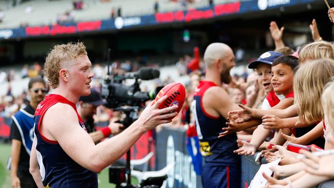 Clayton Oliver celebrates with fans after the win over the Bulldogs. (Photo by Dylan Burns/AFL Photos via Getty Images)