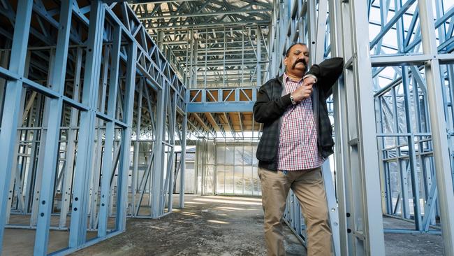 Rajinder Kumar with his shell of his home at Griffin left half built by collapsed builder MSN Homes, for which he has been paying the construction costs for the last three years. Picture Lachie Millard