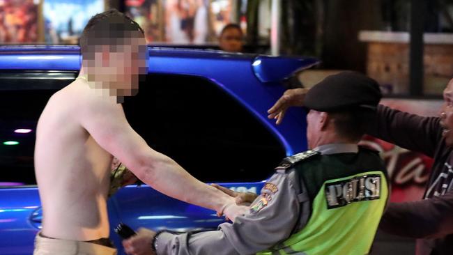 A young Australian man allegedly pushed a policeman in the nightclub district in Kuta. Picture: Liam Kidston