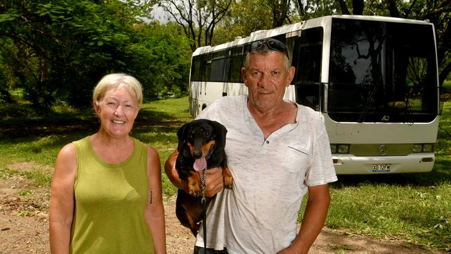 Viv and Geoff Rowan, with their dog Leslie, spent the night in their bus in Ingham as the cyclone raged outside. Picture: Evan Morgan