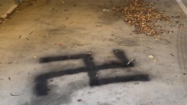 A man has been charged after painting Nazi symbols and offensive phrases around a Penrith unit block on May 30.