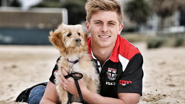 Seb Ross and his 4-month-old pup Nori. Picture: Michael Klein