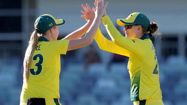 Lauren Cheatle (left) and Jess Jonassen of Australia celebrate after winning the women's one day international against New Zealand back in 2019.