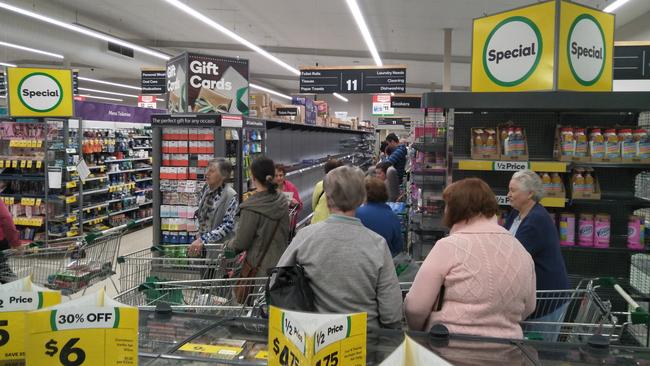 Shoppers queued up at Woolworths in Blackburn North for toilet paper.