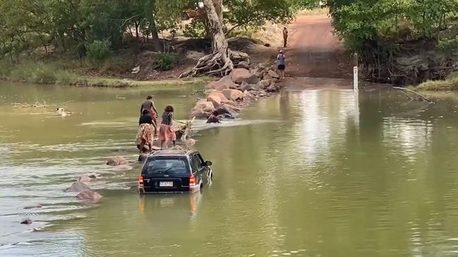 A group of people stranded on Cahills Crossing had to rock hop across the notorious body of water to escape. Picture: Supplied