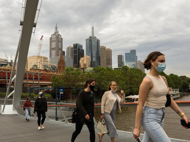 Pedestrians walking across the Yarra River in Melbourne. Picture: Asanka Ratnayake/Getty Images