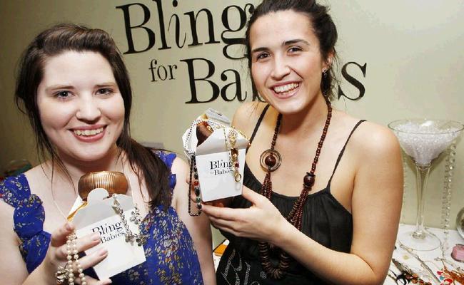 Laurelle Franklin and Madeleine Bushnell had a ball checking out the sparkly stuff at Bling for Babies fundraising night. . Picture: David Nielsen