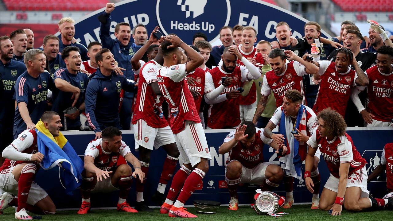 Arsenal were in stitches after captain Pierre-Emerick Aubameyang (C front) dropped the FA Cup trophy.