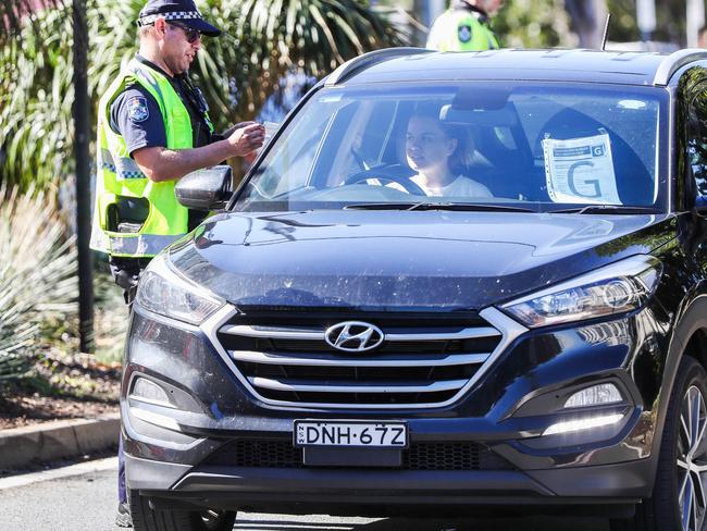 Queensland police check cars at the border. Picture: Nigel Hallett