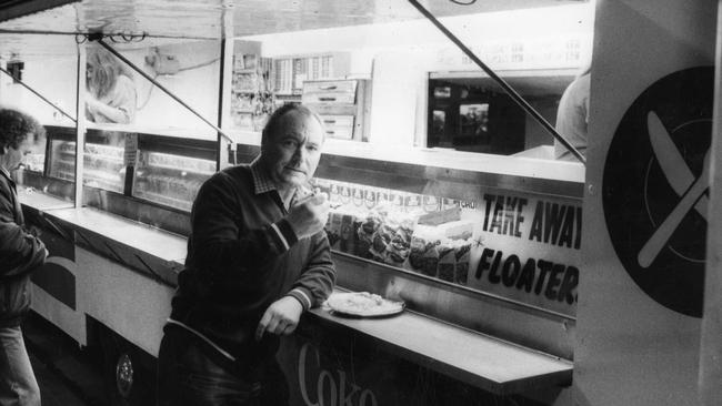 Charles Oram, then aged 61, eating one of his famous pie floaters at the North Terrace pie cart in 1985.